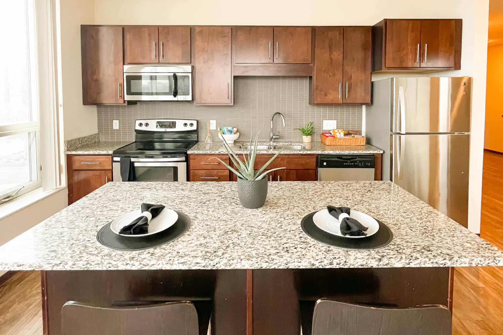 the knoll dinkytown off campus apartments near the university of minnesota kitchen extra wide island with seating stainless steel appliances granite countertops